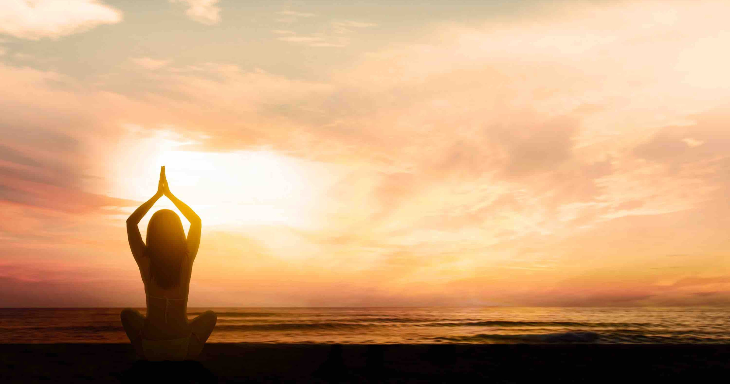 silhouette,of,young,woman,exercising,yoga,while,doing,meditation,at